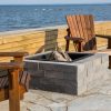 Ocean side backyard setting featuring Shaw Brick's Classic Weathered WallStone proucts around firepit