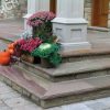 fall garden display with flowers and pumpkins
