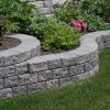 Lush garden using Shaw Brick's Stack Stone retaining wall bricks