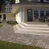 Side patio of a home featuring Shaw Brick's Tumbled OldStone bricks on the walkway